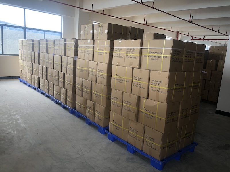 Factory warehouse storing bulk herman miller aeron chair casters ready for global shipping