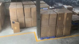 Organized warehouse inventory of commercial computer chair parts ready for global shipping by Tincci